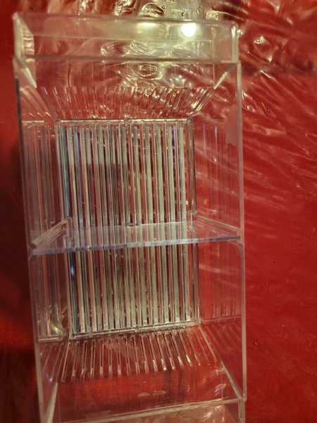 Floating breeder box with slits in sides