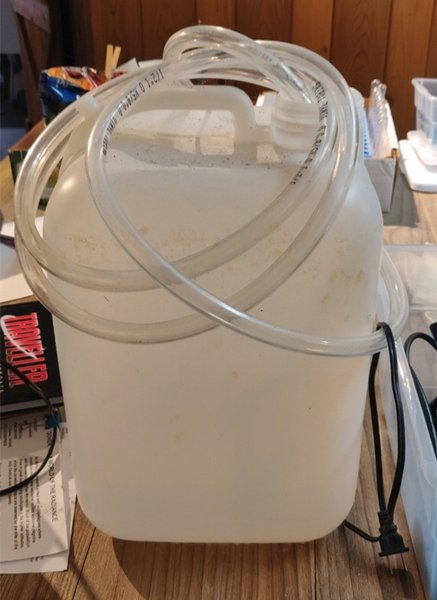 Water fill jug with pump and hose